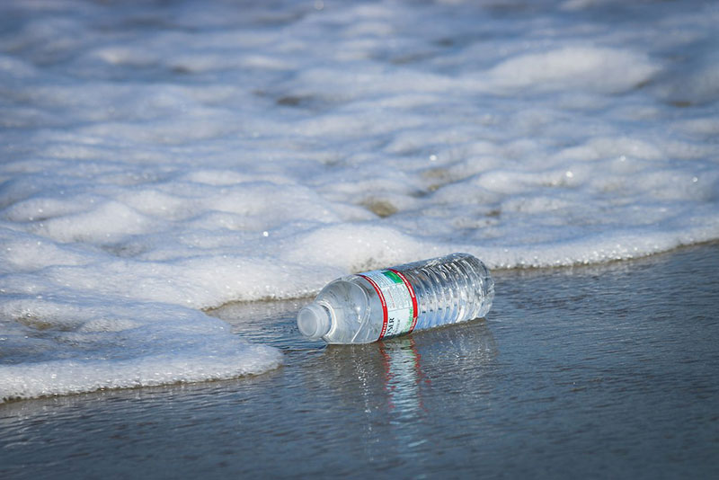 a plastic bottle on the beach