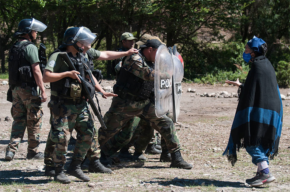 militarized police facing an unarmed demonstrator