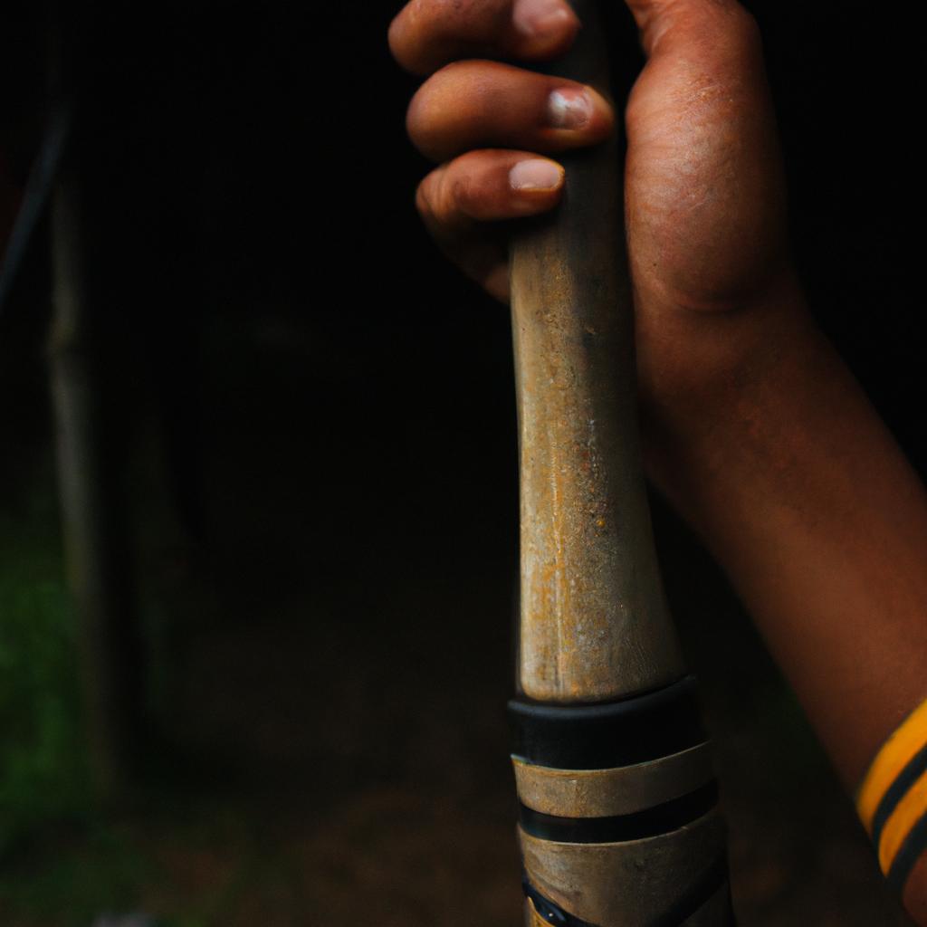 Person holding a tribal staff